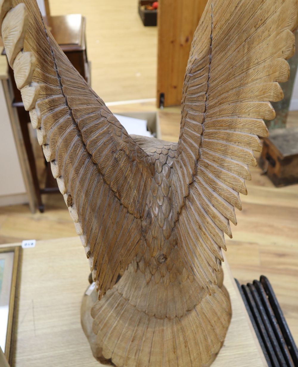 A contemporary carved wood model of a Golden Eagle